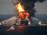 Fire boat response crews battle the blazing remnants of the off shore oil rig Deepwater Horizon in 2010. The explosion  killed 11 workers and polluted the coastline from Louisiana to Florida