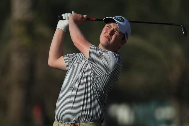 Bob Macintyre plays his second shot on the 14th hole in the first round of the Omega Dubai Desert Classic at Emirates Golf Club. Picture: Andrew Redington/Getty Images.