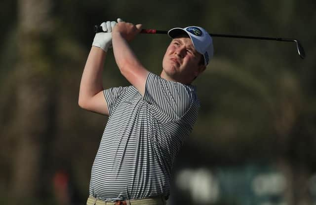 Bob Macintyre plays his second shot on the 14th hole in the first round of the Omega Dubai Desert Classic at Emirates Golf Club. Picture: Andrew Redington/Getty Images.