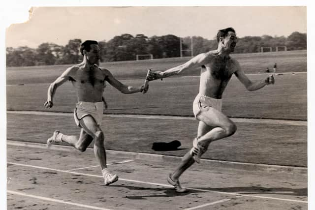 Ming Campbell is handed the baton by teammate Ron Jones in a training session ahead of the Tokyo 1964 Olympic Games. PIC: J Silverside/Daily Mail/Shutterstock.