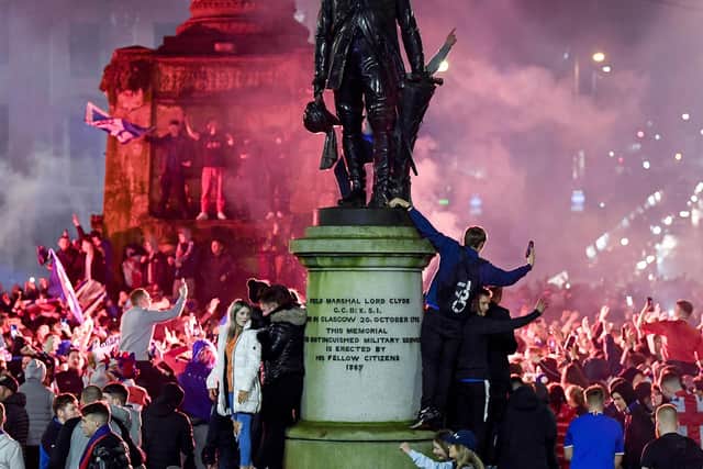 Rangers fans gather in George Square to celebrate the club winning the Scottish Premiership for the first time in 10 years,