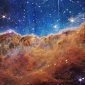NASA image from the James Webb Space Telescope (JWST) which  shows a landscape of mountains and valleys speckled with glittering stars, which sits at the edge of a nearby, young, star-forming region called NGC 3324 in the Carina Nebula. The image was partly produced by an instrument which was largely designed and built in Scotland under the leadership of Professor Gillian Wright of the UK Astronomy Technology Centre (UK ATC)  at the Royal Observatory in Edinburgh.  Photo by HANDOUT/NASA/AFP via Getty Images)