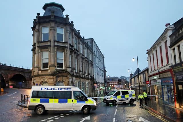 A police cordon at West George Street in Kilmarnock, where officers continue to investigate what Police Scotland describe as a "serious incident" in the grounds of a local hospital and another location in the area. Picture date: Friday February 5, 2021. PA Photo. Police said the incidents are not being treated as terrorist-related but are potentially linked. See PA story SCOTLAND Hospital. Photo credit should read: Jane Barlow/PA Wire