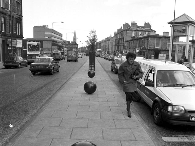 Community art - large balls painted black were set into the central reservation in Edinburgh's Leith Walk, April 1990.