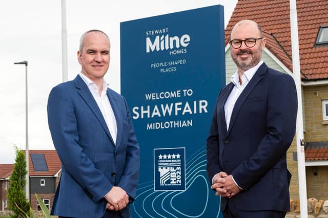 Stuart MacGregor, chief executive of Stewart Milne Group, alongside chief financial officer Fraser Park, at the firm's Shawfair development.