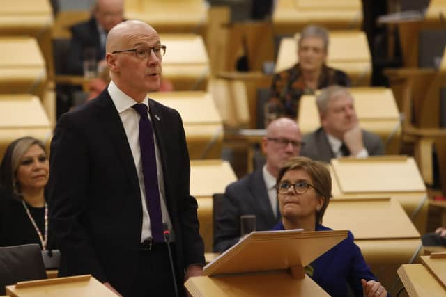 Deputy First Minister John Swinney MSP was watched by First Minister Nicola Sturgeon as he delivered his budget to the Scottish Parliament.Picture: Andrew Cowan/Scottish Parliament/PA Wire