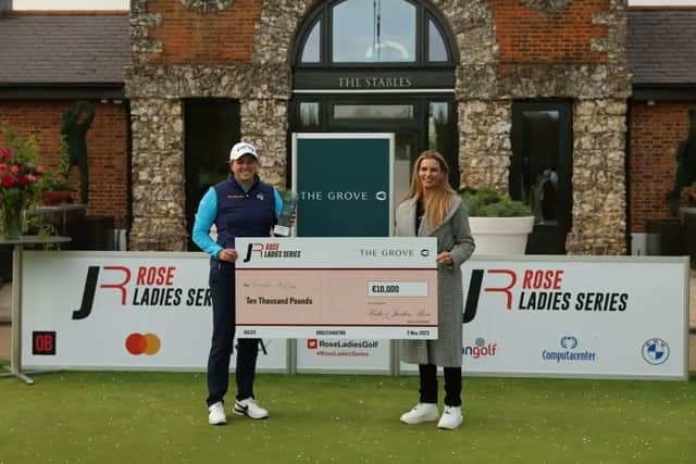 Hannah McCook is presented with a mock cheque for Kate Rose, Justin's wife, after winning the final event of the current Rose Ladies Series campaign. Picture: Rose Ladies Series