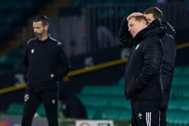 Neil Lennon, right, is under severe pressure after the defeat by Ross County.
