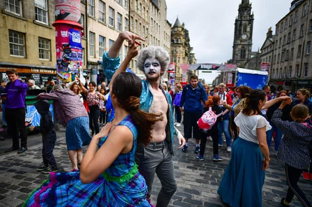 Edinburgh Festival Fringe entertainers perform on the Royal Mile in 2019 (Picture: Jeff J Mitchell/Getty Images)