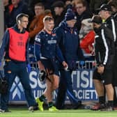 Edinburgh's Darcy Graham goes off injured after hurting his knee against the Lions.
