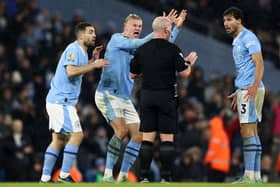 Manchester City Erling Haaland takes umbrage with a refereeing decision.