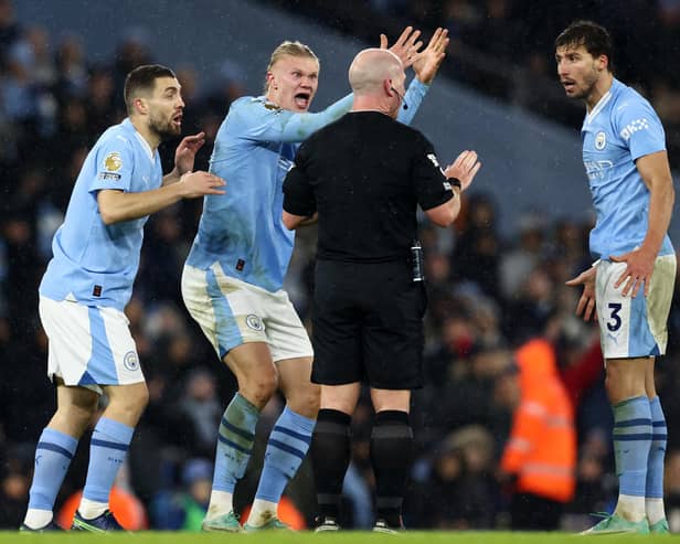 Manchester City Erling Haaland takes umbrage with a refereeing decision.