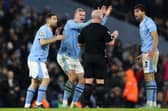 Manchester City Erling Haaland takes umbrage with a refereeing decision.