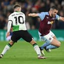 Aston Villa captain John McGinn is challenged by Liverpool midfielder Alexis Mac Allister during the 3-3 draw at Villa Park. (Photo by Shaun Botterill/Getty Images)