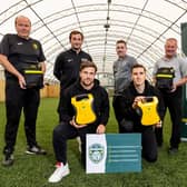 The Hanlon Stevenson Foundation have donated defibrillators to four local youth clubs – Hutchison Vale, Leith Athletic, Salvesen and Street Soccer Scotland.
Hibernian duo Lewis Stevenson and Paul Hanlon were at World of Football in Edinburgh to make the presentation. Photo by Alan Rennie