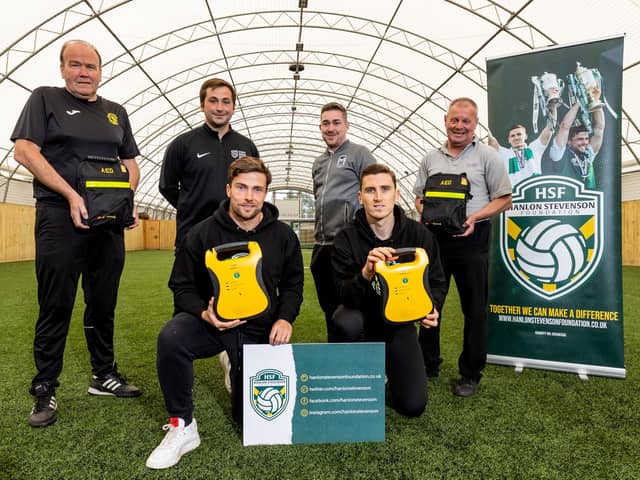 The Hanlon Stevenson Foundation have donated defibrillators to four local youth clubs – Hutchison Vale, Leith Athletic, Salvesen and Street Soccer Scotland.
Hibernian duo Lewis Stevenson and Paul Hanlon were at World of Football in Edinburgh to make the presentation. Photo by Alan Rennie