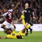 Leon Bailey of Aston Villa is challenged by Yasser Larouci of Sheffield United.