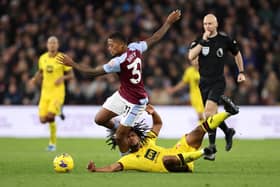 Leon Bailey of Aston Villa is challenged by Yasser Larouci of Sheffield United.