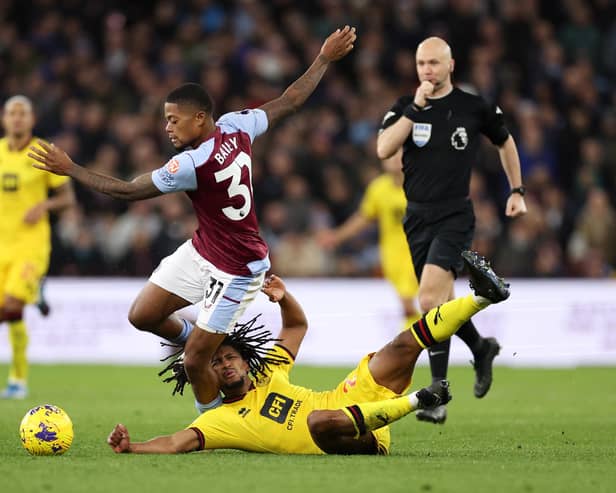 Leon Bailey of Aston Villa is challenged by Yasser Larouci of Sheffield United.