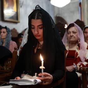 Palestinian Orthodox Christians attend the Easter mass at the church of Saint Porphyrius in Gaza City, amid the ongoing conflict between Israel and the militant Hamas movement. Picture: AFP via Getty Images