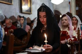 Palestinian Orthodox Christians attend the Easter mass at the church of Saint Porphyrius in Gaza City, amid the ongoing conflict between Israel and the militant Hamas movement. Picture: AFP via Getty Images