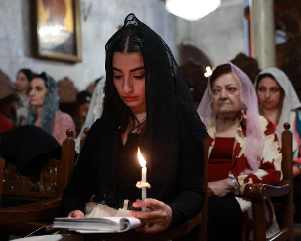 Palestinian Orthodox Christians attend the Easter mass at the church of Saint Porphyrius in Gaza City, amid the ongoing conflict between Israel and the militant Hamas movement. Picture: AFP via Getty Images