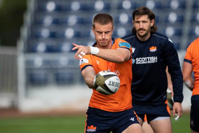 Edinburgh winger Freddie Owsley fires out a pass in training, with scrum-half Henry Pyrgos watching on. Picture: Paul Devlin/SNS