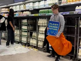 Handout photo issued by Animal Rebellion of supporters of Animal Rebellion pouring out milk in a Waitrose in Edinburgh. Issue date: Saturday October 15, 2022.