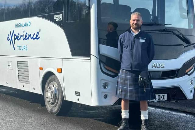 Tour guide Steven with one of the swish new buses. Picture: contributed.