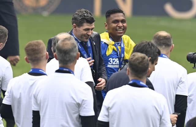 Rangers' Alfredo Morelos covers manager Steven Gerrard in champagne during the Scottish Premiership match  between Rangers and Aberdeen  at Ibrox Stadium, on May 15, 2021, in Glasgow, Scotland. (Photo by Rob Casey / SNS Group)