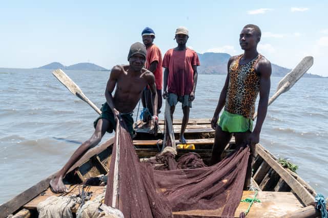 Fishermen Samson Maliko, Charles Mitule, Flechala Sochela and Dumba say climate change is having a major impact on their lives, causing Lake Chilwa to dry out completely in each of the past few years - sparking food shortages and high air humidity that makes it difficult to breath. Picture: Dennis Lupenga