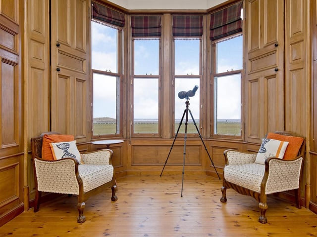 The living room with a stunning bay window offering some of the best views in Fife, if not Scotland.