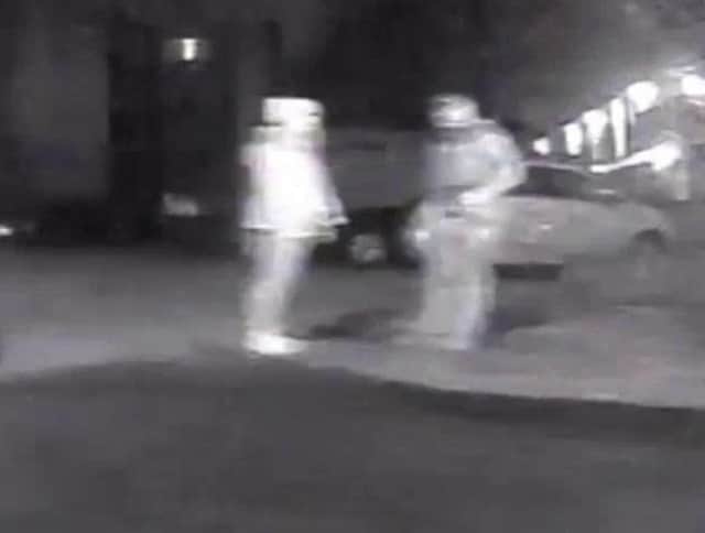 Handout CCTV dated 03/03/21 taken at 9.34pm issued by the Metropolitan Police of Wayne Couzens (right) and Sarah Everard beside a vehicle outside Poynders Court on Poynders Road, Clapham, south London.