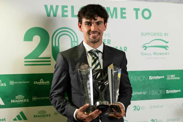 Matt O'Riley shows off his awards haul after the Celtic awards ceremony.