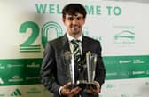 Matt O'Riley shows off his awards haul after the Celtic awards ceremony.