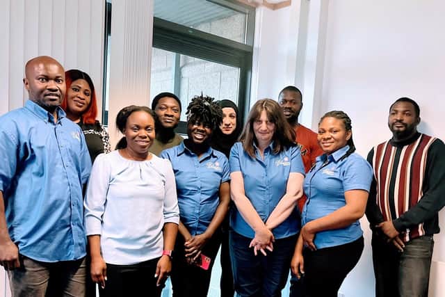 Dr Innocent Iba (left) and Josephine Iba (front left) with members of Blossom Home Care Aberdeen's care team