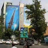 A giant billboard, covering the side of a building in Tehran, shows a Fattah hypersonic missile, reportedly capable of travelling at 15 times the speed of sound (Picture: Atta Kenare/AFP via Getty Images)