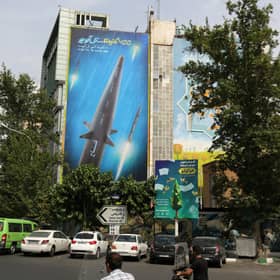 A giant billboard, covering the side of a building in Tehran, shows a Fattah hypersonic missile, reportedly capable of travelling at 15 times the speed of sound (Picture: Atta Kenare/AFP via Getty Images)