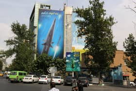 A giant billboard, covering the side of a building in Tehran, shows a Fattah hypersonic missile, reportedly capable of travelling at 15 times the speed of sound (Picture: Atta Kenare/AFP via Getty Images)