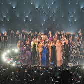 Duncan Laurence performs "You'll Never Walk Alone" on stage during The Eurovision Song Contest. Groups of singers from Ukraine joined in via video link, while all entrants in the competition also joined him on stage.