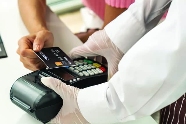 Many shops have begun to only accept card payments due to the pandemic, spurred on by the new upper spending limit of £45 for contactless payments. Inset, there will be no more new two pence or two pound coins for at least a decade. Picture: Shutterstock