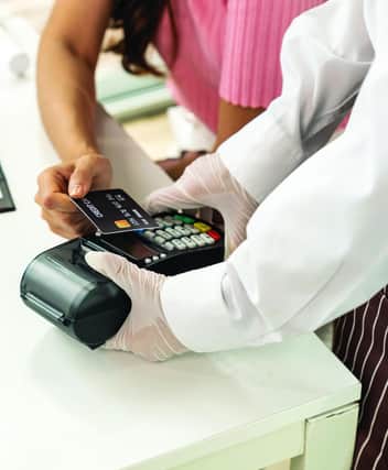 Many shops have begun to only accept card payments due to the pandemic, spurred on by the new upper spending limit of £45 for contactless payments. Inset, there will be no more new two pence or two pound coins for at least a decade. Picture: Shutterstock