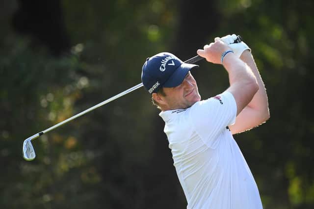 Marc Warren tees off on the fourth hole during Day one of the DP World Tour Championship at Jumeirah Golf Estates last month. Picture: Ross Kinnaird/Getty Images.