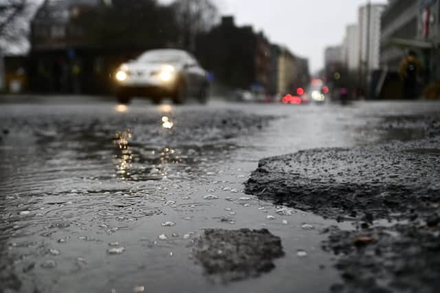 Pothole on Duke Street in east end of Glasgow on Tuesday. (Photo by John Devlin/The Scotsman)