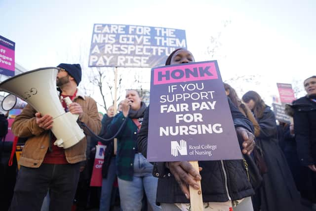 Members of the Royal College of Nursing (RCN) on the picket line south of the border. Members in Scotland have also voted for strike action. Picture: James Manning/PA Wire