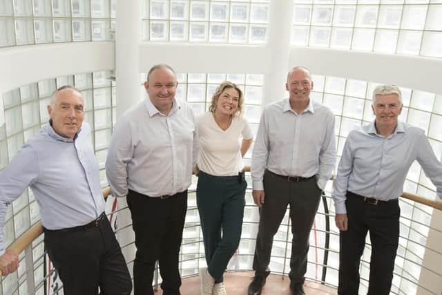 Left to right: Alistair Sloan, Iain Collins, Susan Cardwell, Clark Moore and Jim Pritchard, of Redpath Construction.
