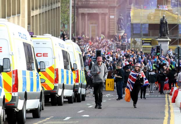 Rangers fans celebrate winning the Scottish Premiership in George Square, Glasgow, after their match against Aberdeen. Picture: PA