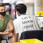A man receives a coronavirus vaccination at Twickenham rugby stadium where up to 15,000 doses are ready to be administered at the walk-in centre set up for residents of north-west London. Picture: Dominic Lipinski/PA Wire