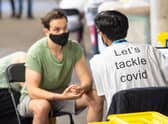 A man receives a coronavirus vaccination at Twickenham rugby stadium where up to 15,000 doses are ready to be administered at the walk-in centre set up for residents of north-west London. Picture: Dominic Lipinski/PA Wire