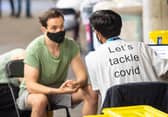 A man receives a coronavirus vaccination at Twickenham rugby stadium where up to 15,000 doses are ready to be administered at the walk-in centre set up for residents of north-west London. Picture: Dominic Lipinski/PA Wire